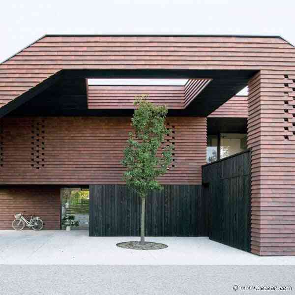 OFIS Arhitekti clads geometric home in Slovenia with red-brick tiles