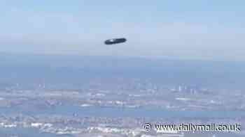 UFO or drone? 'Flying cylinder' spotted soaring over New York City's LaGuardia Airport baffles passenger