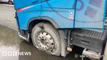 Driver's lucky escape after lorry strikes power line