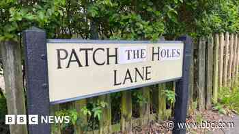 Locals fed up with 'major potholes' alter road sign