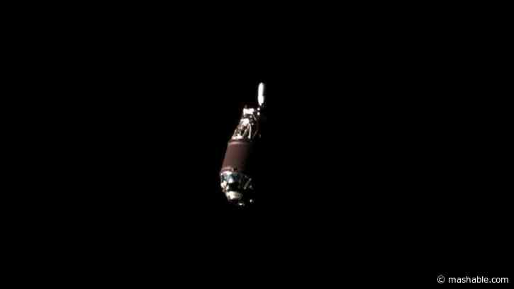 Spacecraft approaches metal object zooming around Earth, snaps footage