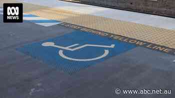 Man taken to hospital after falling from wheelchair onto train tracks