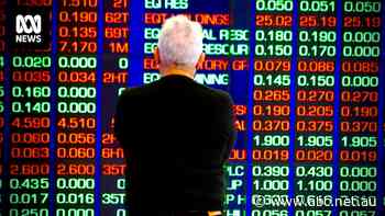 ASX closes higher after US Fed leaves rates on hold and indicates rate hike 'unlikely', NAB half-year profit drops 11.9pc — as it happened