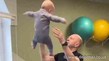 Outrage over video of 'idiot' dad doing acrobatic-like stunts with his new BABY - as doctors warn it could cause deadly brain injuries