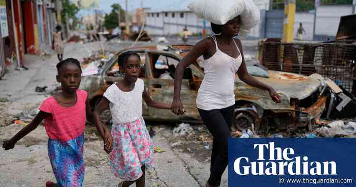 Residents flee as Haitian gangs launch new gun and arson attacks in capital