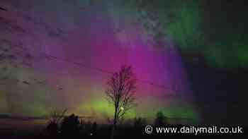 US enjoys dazzling Northern Lights show stretching from Maine to Alabama after 'extreme' solar storm that could knock out power lines and communications