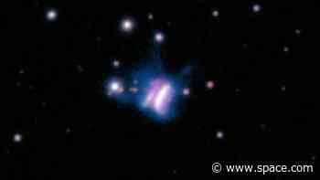 Cosmic butterfly or interstellar burger? This planet-forming disk is the largest ever seen