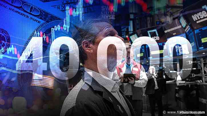 Dow closes above 40,000 for first time