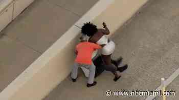 Woman arrested after wild video shows her trying to stab 2 men with screwdriver after crash