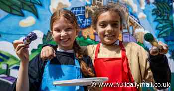 Children's imaginations harnessed in murals depicting 'cities of the future' - including litter-picking robots and free-roaming animals