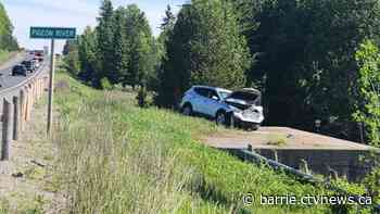 Driver charged after crashing through Highway 35 guardrail, injuring passenger