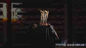 Boots worn by bull rider Ty Pozzobon on display in Calgary museum