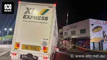 Pacific Highway closed for five hours after truck smashes into shopfront