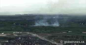 Fire crews battle large grassfire west of Calgary