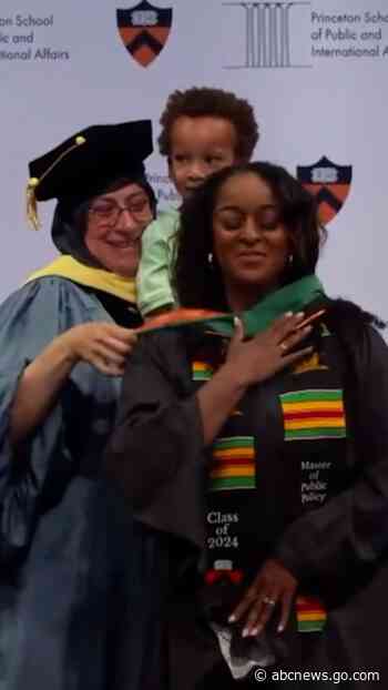 WATCH:  Adorable 3-year-old helps mom with master’s hood at graduation ceremony
