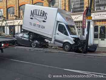 Chalk Farm Road shut as car and lorry damaged in crash