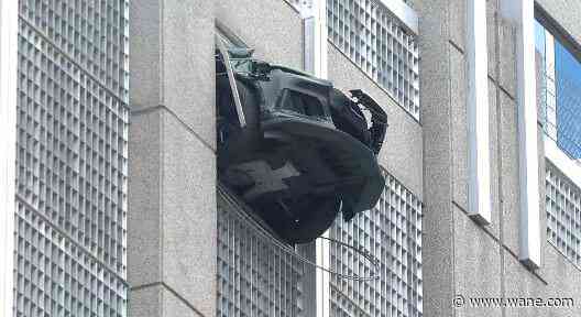 Car seen 'dangling' from Charlotte parking garage
