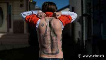 Inked for the Oilers: Superfan vows to get big back tattoo fixed up if Edmonton wins