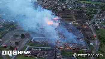 Roads remain closed after blaze at former DWP site