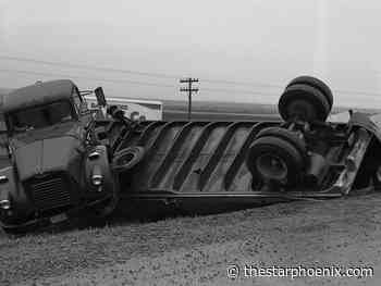 RCMP watch over unbroken bottles in 1959 after beer truck rollover