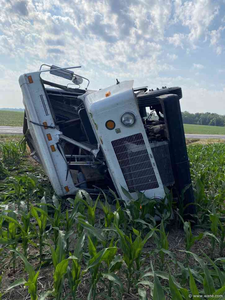 FedEx truck ends up in a DeKalb County field after driver overcorrects