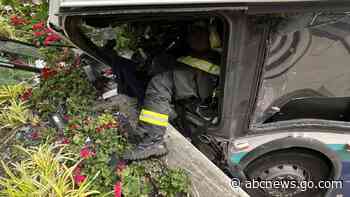 At least 11 injured as bus crashes into Seattle building, fire department says