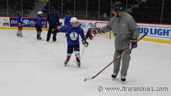 Retired Mich. firefighter uses hockey to mentor inner-city kids