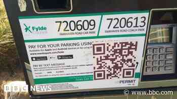 Scammers put fake QR codes on parking machines