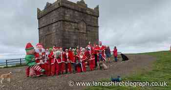 Why group of Santas climbed Rivington Pike 6 months before Christmas
