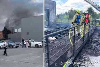 Dakterras van Action in lichterlaaie, overslag naar binnen nipt vermeden