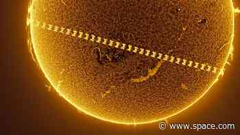 See the sun rage behind the ISS in epic time-lapse photo