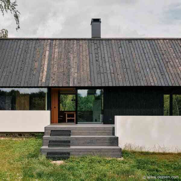 Stone cellar in Estonian forest forms base for wooden Põro House