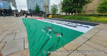 Giant Palestine flag unfurled in Blackburn town centre