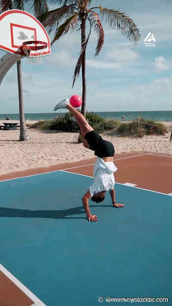 Watch this guy nail the ultimate trick shot with his insane freestyle football skills!