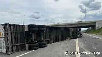 Driver injured in tractor-trailer rollover on ramp to Highway 400