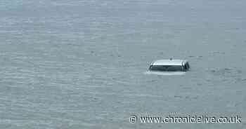 Car stranded in the North Sea after reportedly rolling into the water in Northumberland