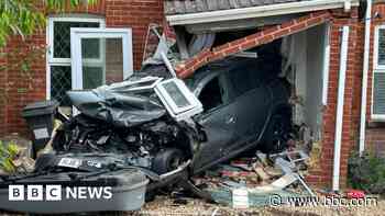 Car smashes through front of house after crash