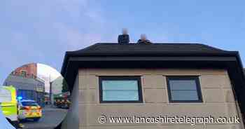 Blackburn: Police and firefighters attend 'reports of people on roof'
