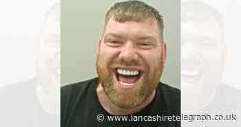 Bacup man laughing in mugshot wanted in police investigation