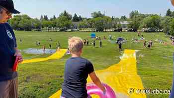 Warman Fire Rescue helps kids beat the heat with giant slip and slide