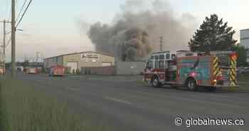 Calgary firefighters battle blaze at metal recycling yard that produced ‘significant smoke column’