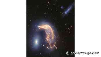 Webb Space Telescope's captures pair of intertwined galaxies glowing in infrared