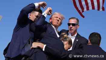 Donald Trump says he is fine after being whisked off stage following apparent gunfire at rally