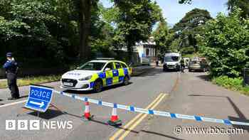 Man arrested after human remains found in suitcases