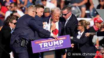 Donald Trump says in social media post he was 'shot with a bullet' in upper part of right ear