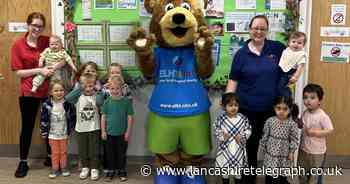 School and nursery children and staff wear blue for NHS 65th birthday
