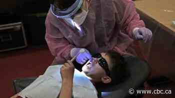 Denturists, dental hygienists, assistants back dental care plan despite dentists' criticisms