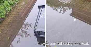 Flooded Blackburn alleyway has been cleared, say council