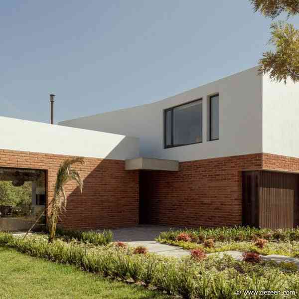 Brick and stucco meet for "harmonious flow" of Quito house