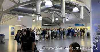 Holidaymakers queue for over an hour at Bournemouth airport